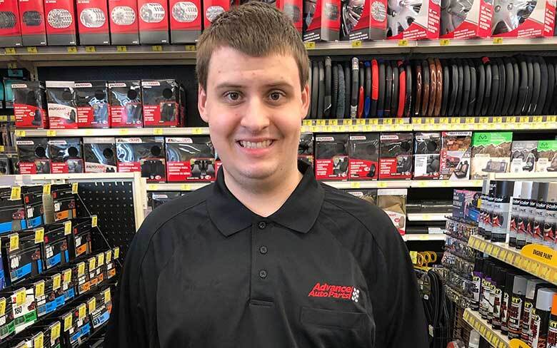 Young man working at Advanced Auto Parts
