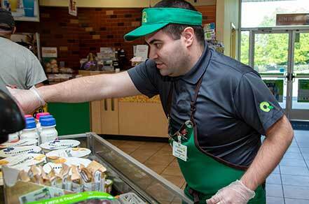 Man with special needs working at a grocery store in Abilities supported employment program