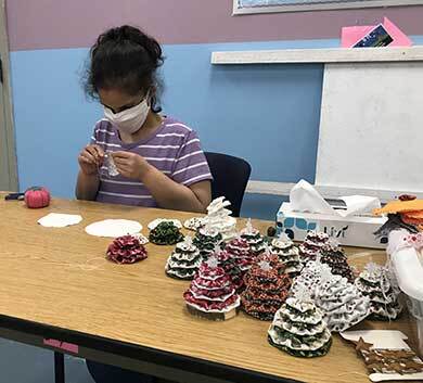 Young woman making hand-crafted decorations at the Abilities Washington Day Program